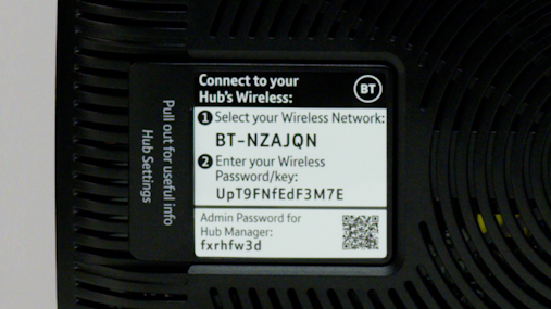 Information card on the back of a hub containing wireless network name and password. 