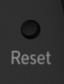 Small pinhole button.
